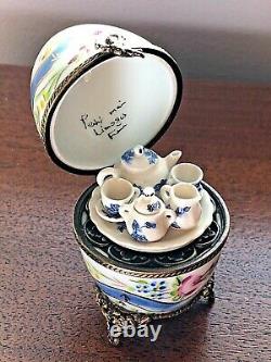 Limoges France Peint Main Porcelain Egg Trinket Box with Tea Set and Cherub Clasp