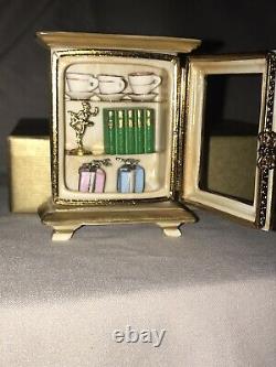Rochard Limoges hand painted porcelain display case with books and trophies